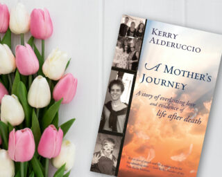 Kerry Alderuccio's book - A Mother's Journey photographed next to some beautiful flowers